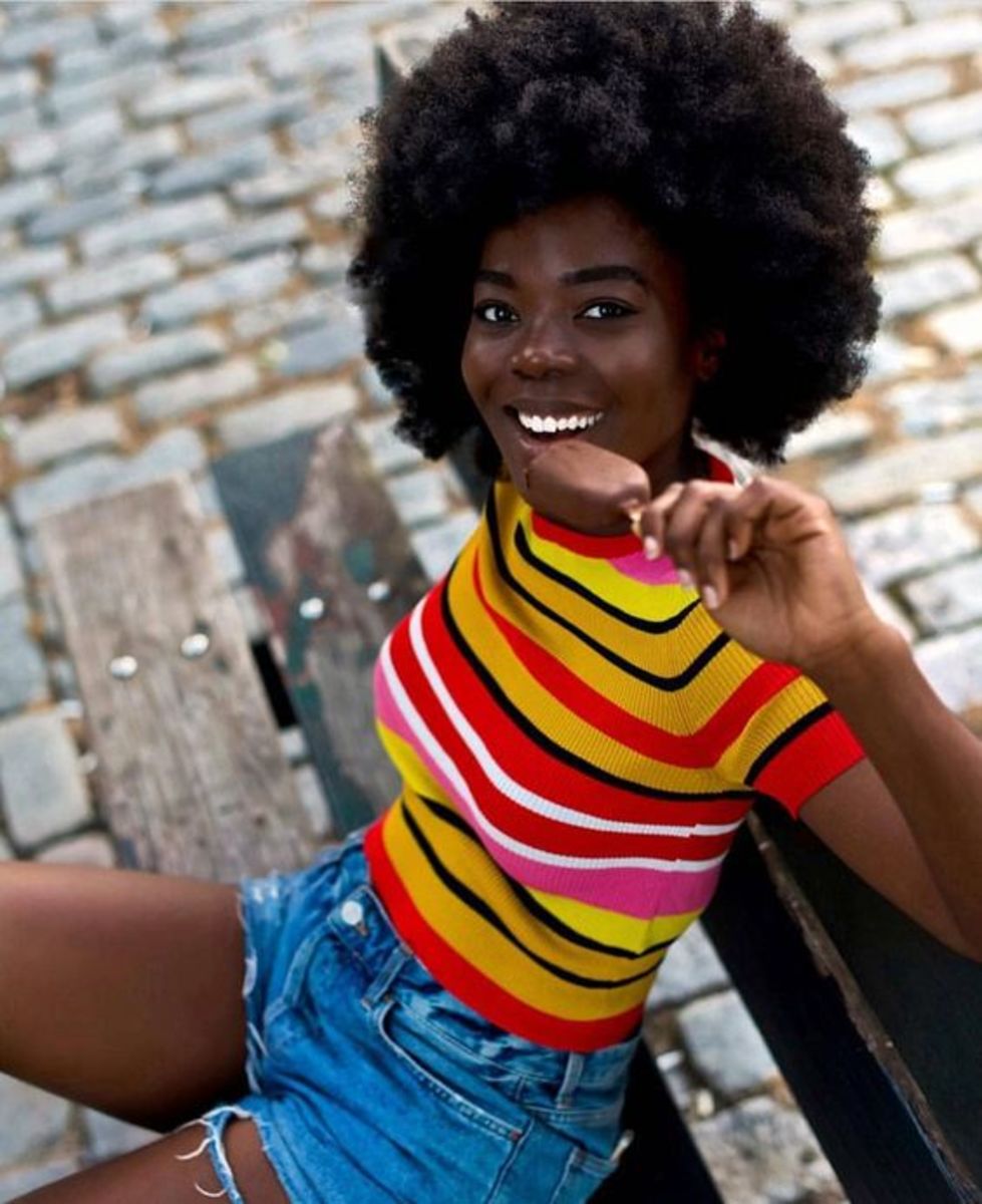 Black Woman with an afro eating ice cream